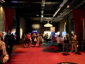 People hanging out at the sponsors' area